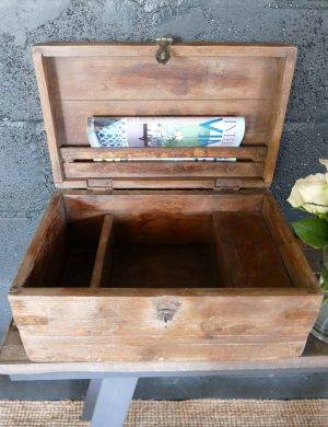 wooden open chest with magazine