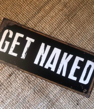 get naked decorative sign