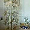 marilyn gold palm leaf screen with furry rug