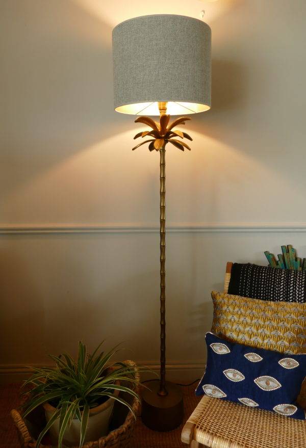 Armata bronze floor lamp in room turned on