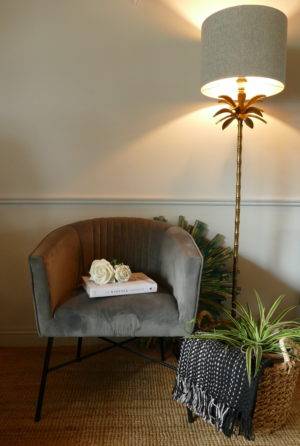 velvet club grey chair in sitting room with lamp from stagers lifestyle shop
