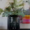 ABSTRACT FACE VASE WITH FLORAL STEMS