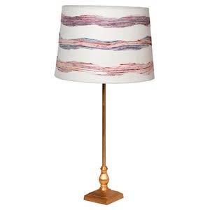 GOLD LAMP WITH PINK AND WHITE SHADE ON WHITE BACKGROUND