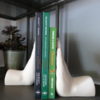 Stone Hand Bookends with books