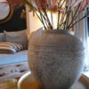 DISTRESSED VASE WITH RED STEM